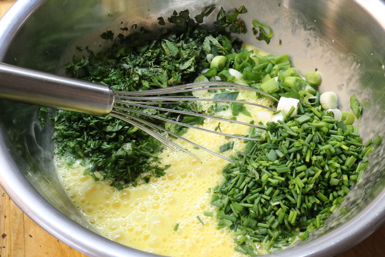 In a mixing bowl combine Ejjeh ingredients with a whisk.