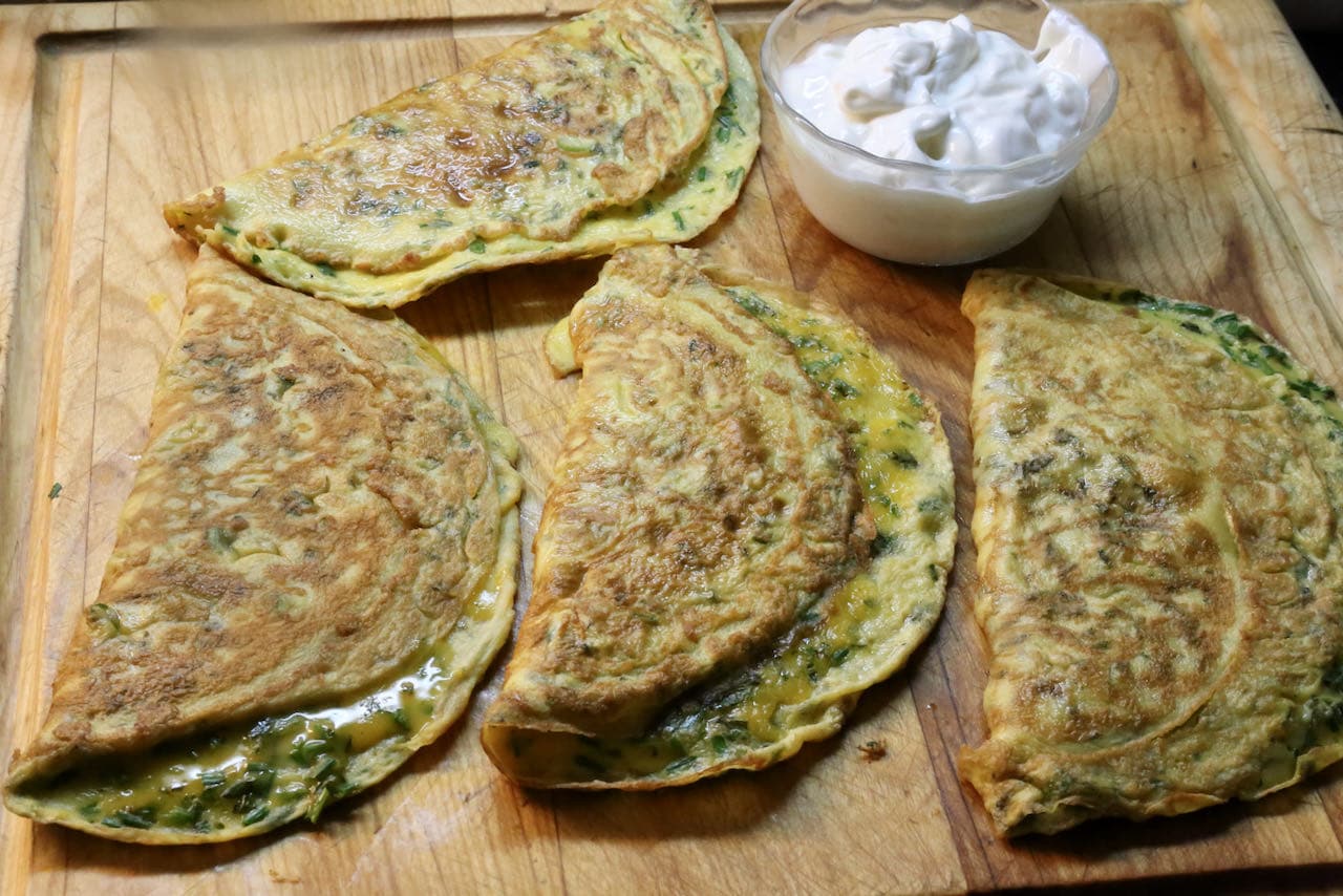 Serve Lebanese Ejjeh with sour cream or Greek yogurt.