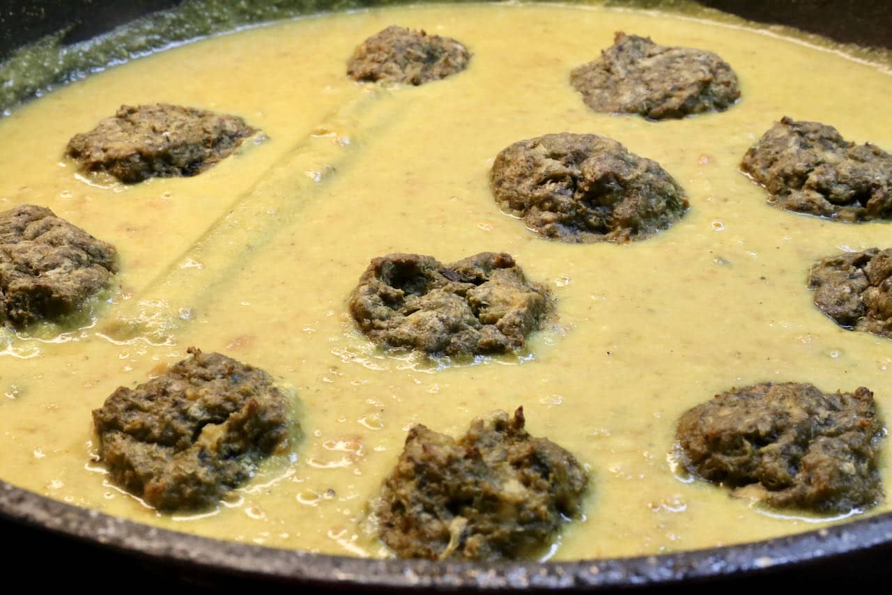 Simmer baked Tofu Meatballs in creamy vegan korma sauce.