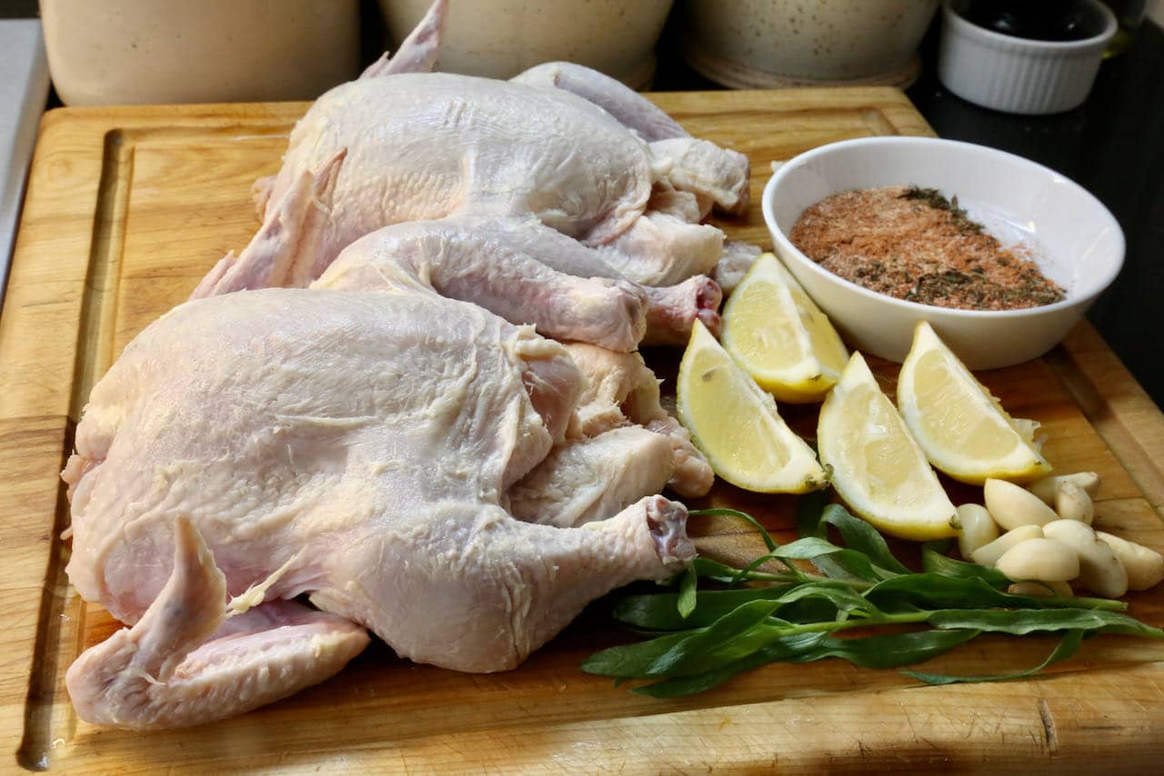 Slather Air Fried Cornish Hen with butter and stuff the cavity with tarragon, garlic and lemon wedges.