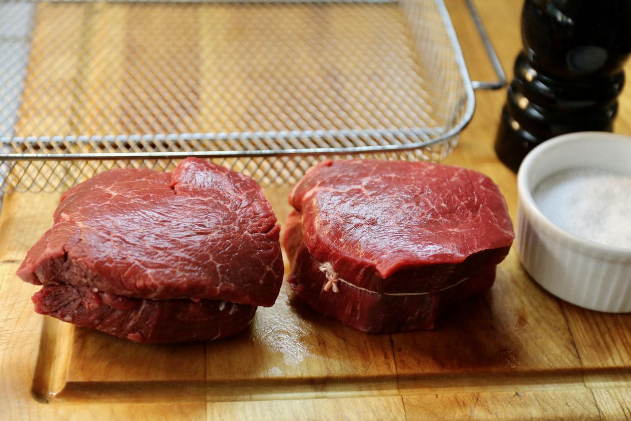 Our easy Air Fryer Filet Mignon recipe features beef tenderloin steaks, salt and pepper.