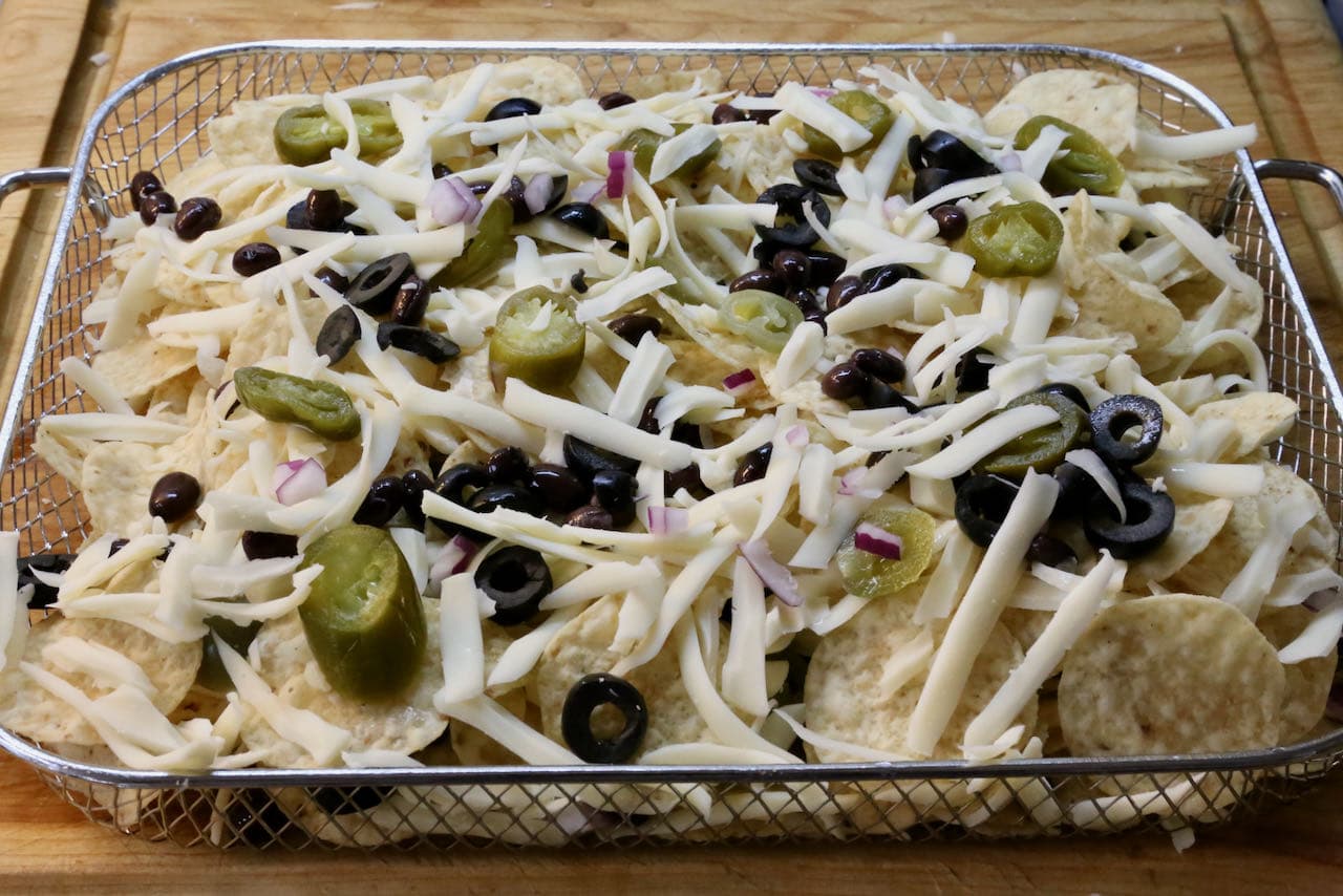 Layer our vegetarian Air Fryer Nachos in a basket.