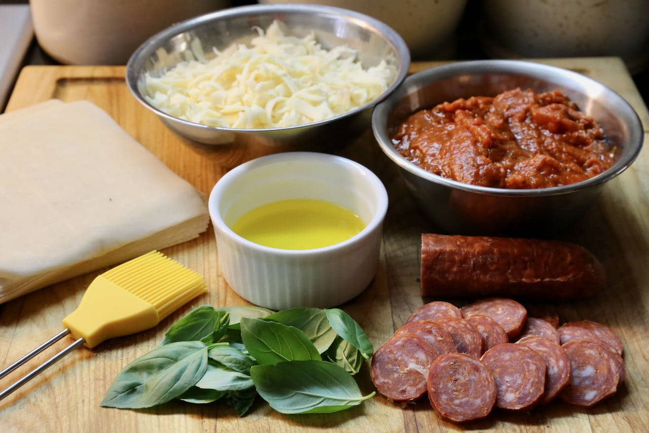 Our Pizza Rolls are filled with mozzarella, marinara tomato sauce, pepperoni and basil.