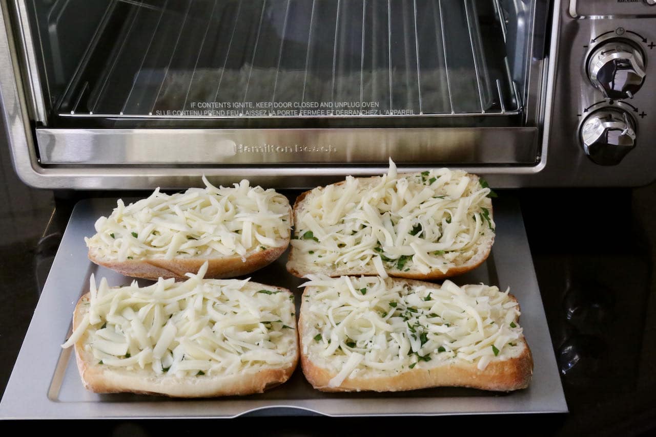 Place Cheesy Garlic Bread slices in Air Fryer and cook until mozzarella has melted.