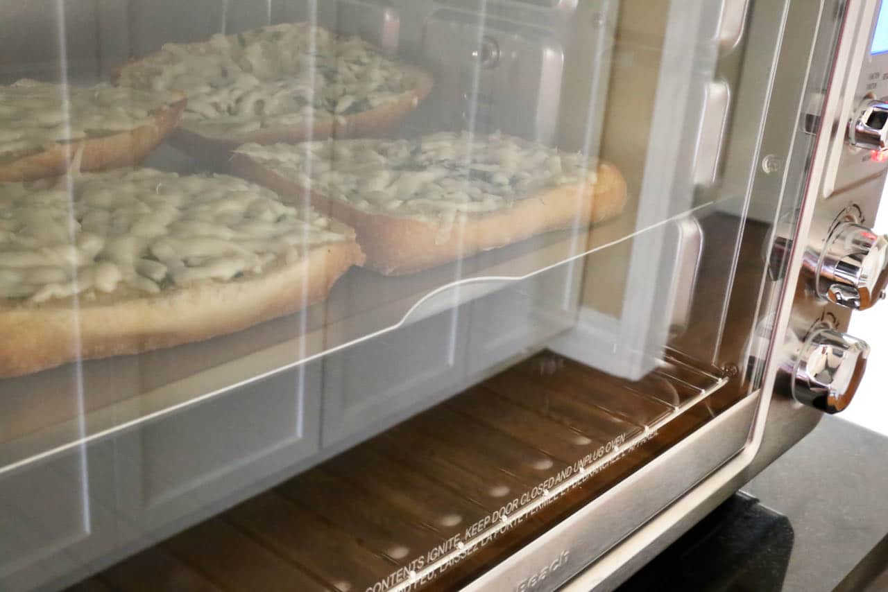 Watch the Garlic Bread cooking through the Air Fryer glass door. 