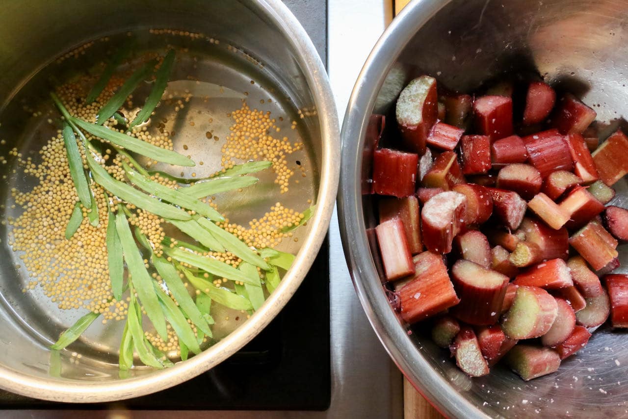 Toss rhubarb in salt then pour hot pickling mixture over the fruit.