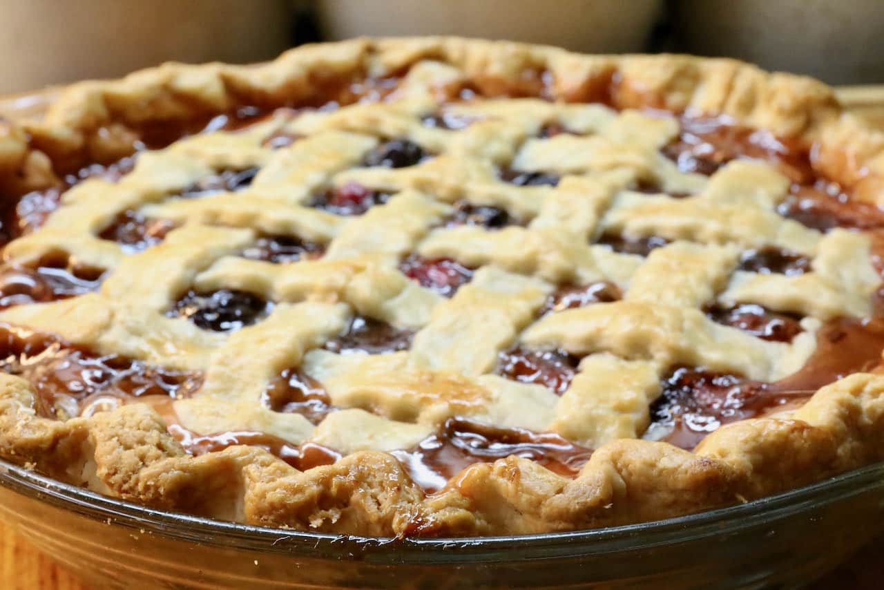 The Rhubarb Cherry Pie is finished baking once the filling bubbles and crust has browned and is flaky. 