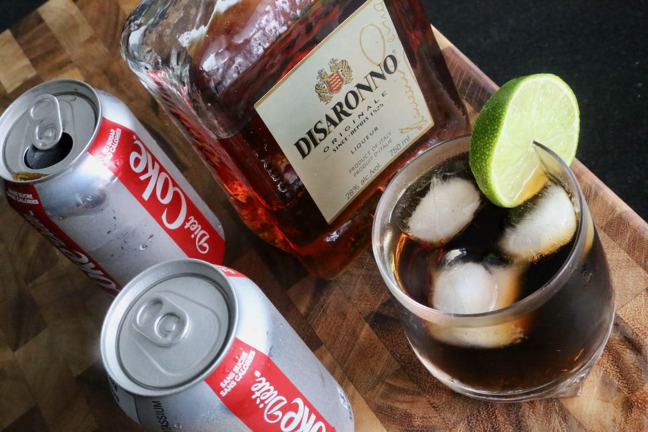 Enjoy a low calorie Disaronno and Coke by using a can of Diet Coke or Coke Zero.
