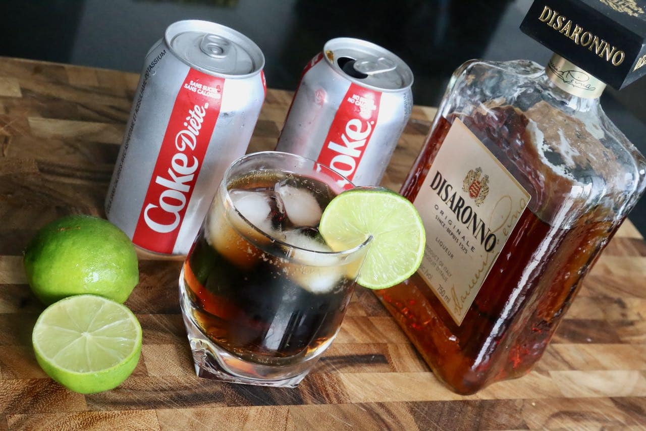 Serve Disaronno and Coke over ice garnished with a lime wheel.