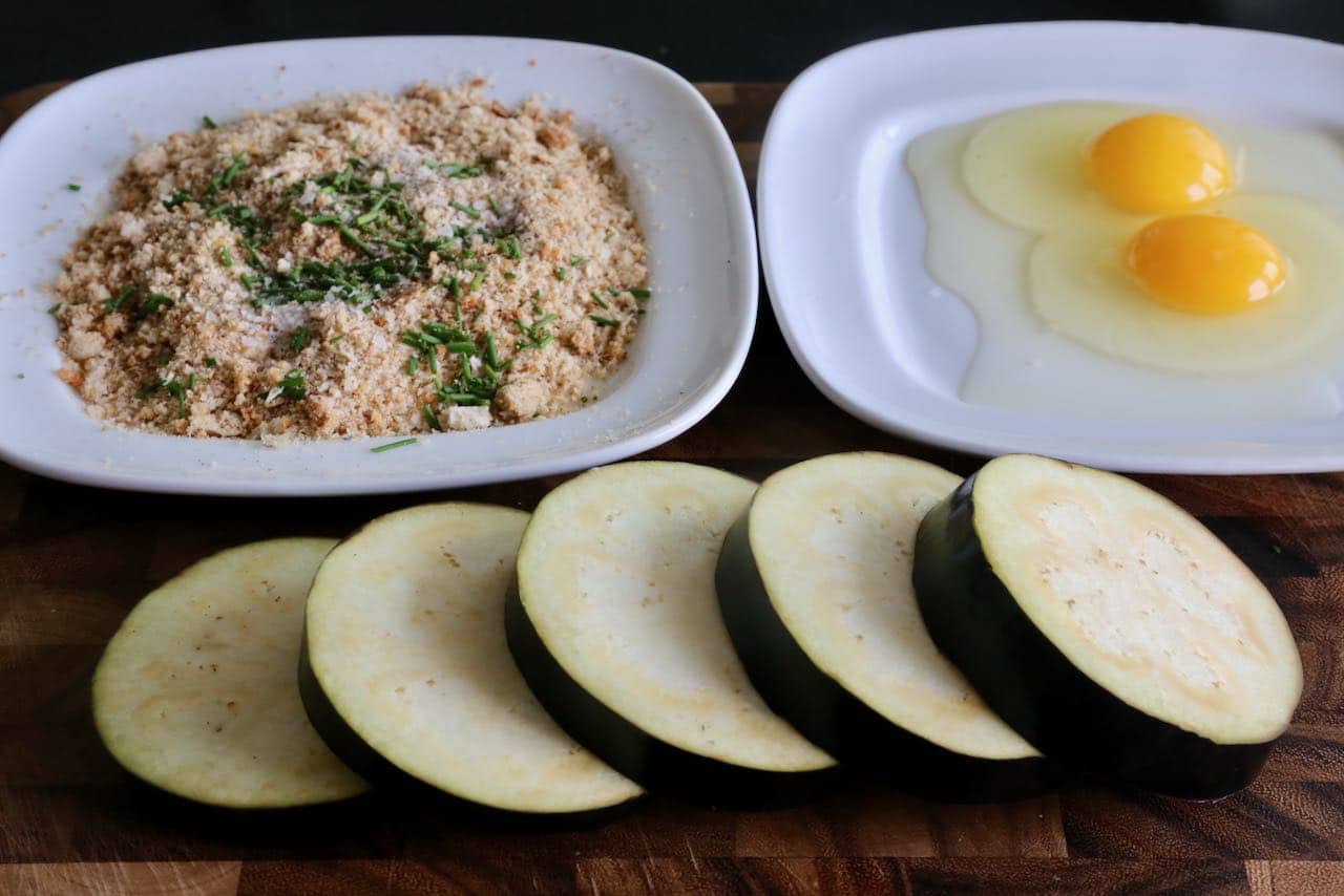 Our easy Air Fryer Eggplant Parm recipe features an egg, bread crumb and parmesan crispy coating.
