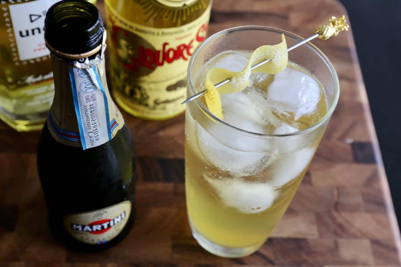 Garnish Liquore Strega Saffron Cocktail with a lemon twist.