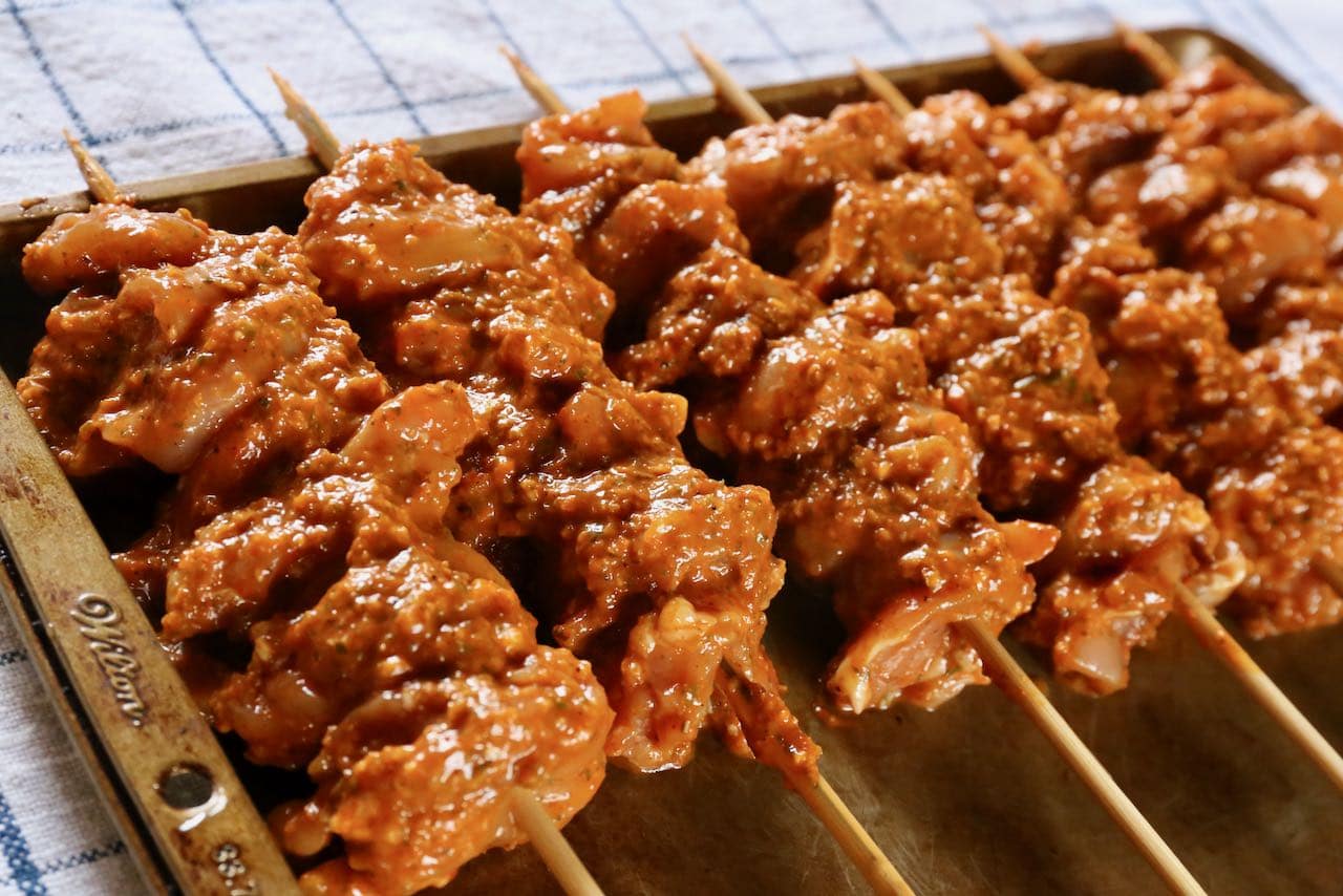 Slide marinated Turkish Chicken Kebabs onto wooden skewers.