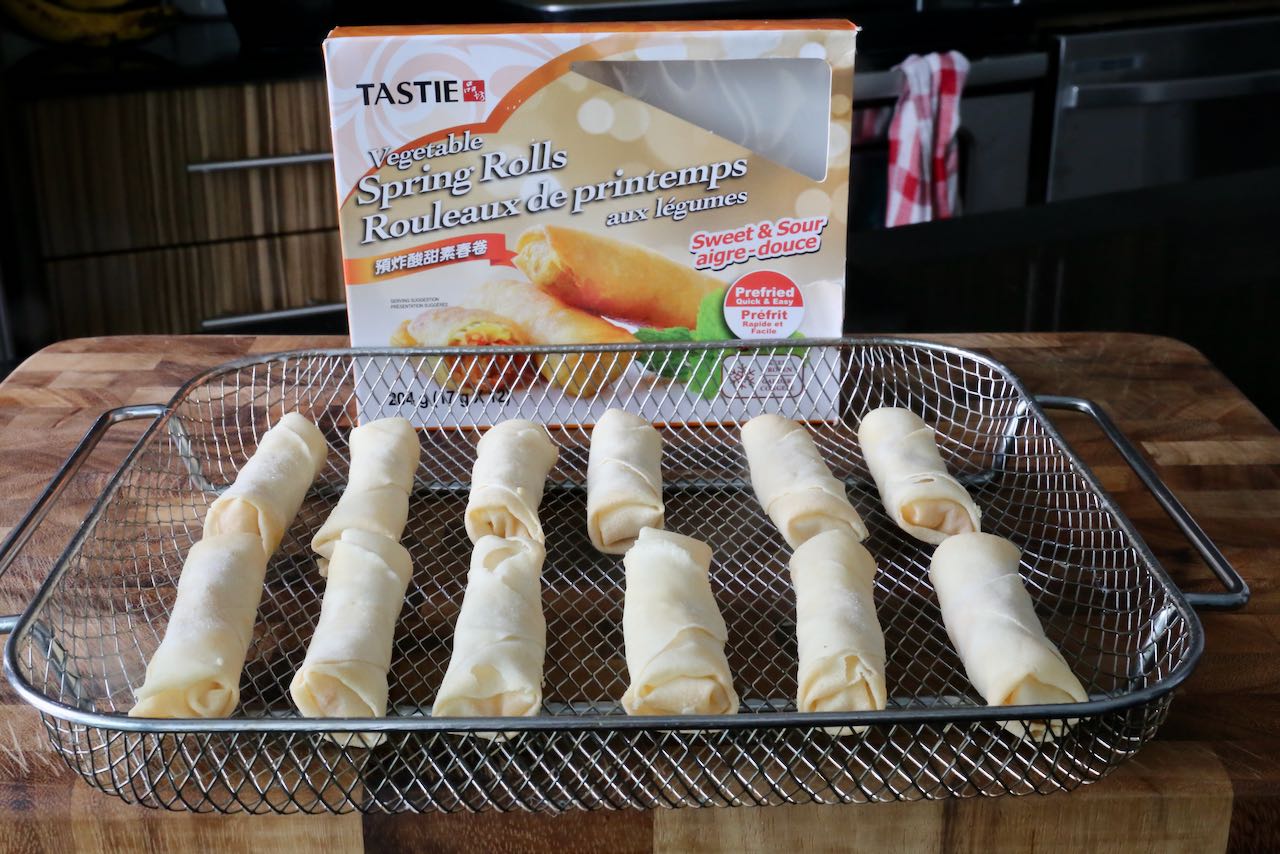 Cook your favourite store bought Frozen Spring Rolls in an air fryer until crispy.