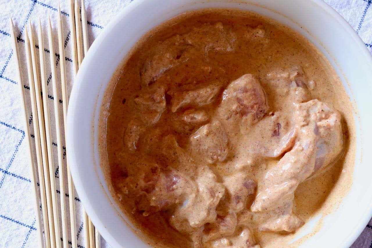 Boti Kabab features marinated chicken pieces that are thread along wooden skewers. 