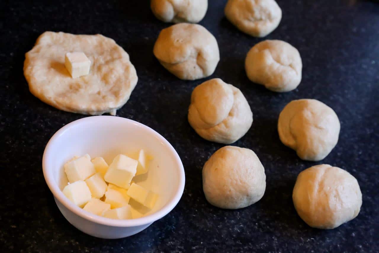 Stuff PappaRoti Bun dough with cubes of cold butter.
