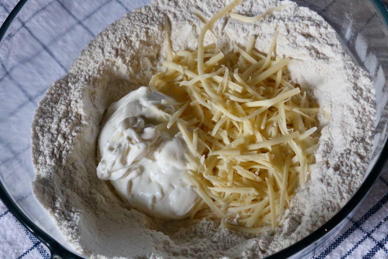 Our easy Pogacsa dough features shredded cheese and sour cream.