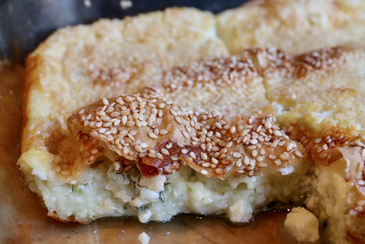 Tepsi Boregi is a Turkish Pie prepared with layers of filo pastry and creamy cheese and herbs.