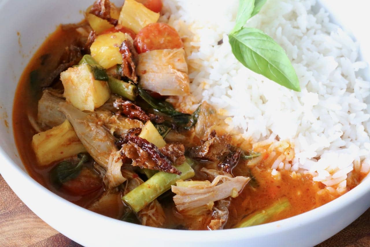 Traditional Duck Thai Red Curry features sweet fruits like tomatoes, pineapple or lychee.