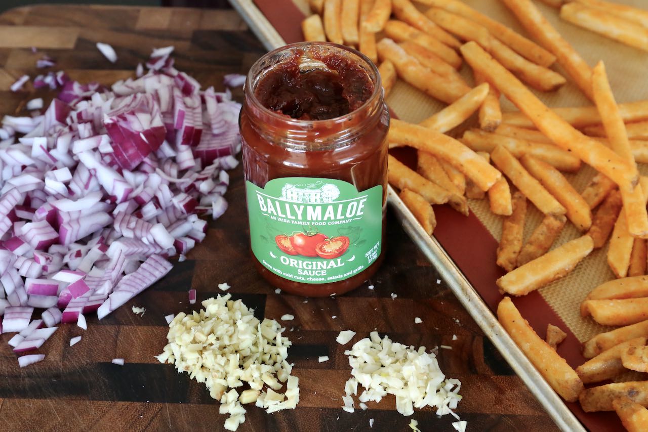 Masala Chips are prepared with crispy French Fries, ginger, garlic, onion and tomato hamburger relish.