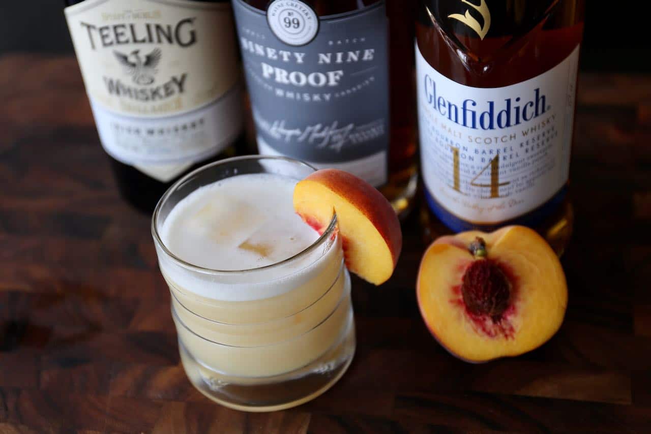 Garnish the drink with a fresh peach slice. 