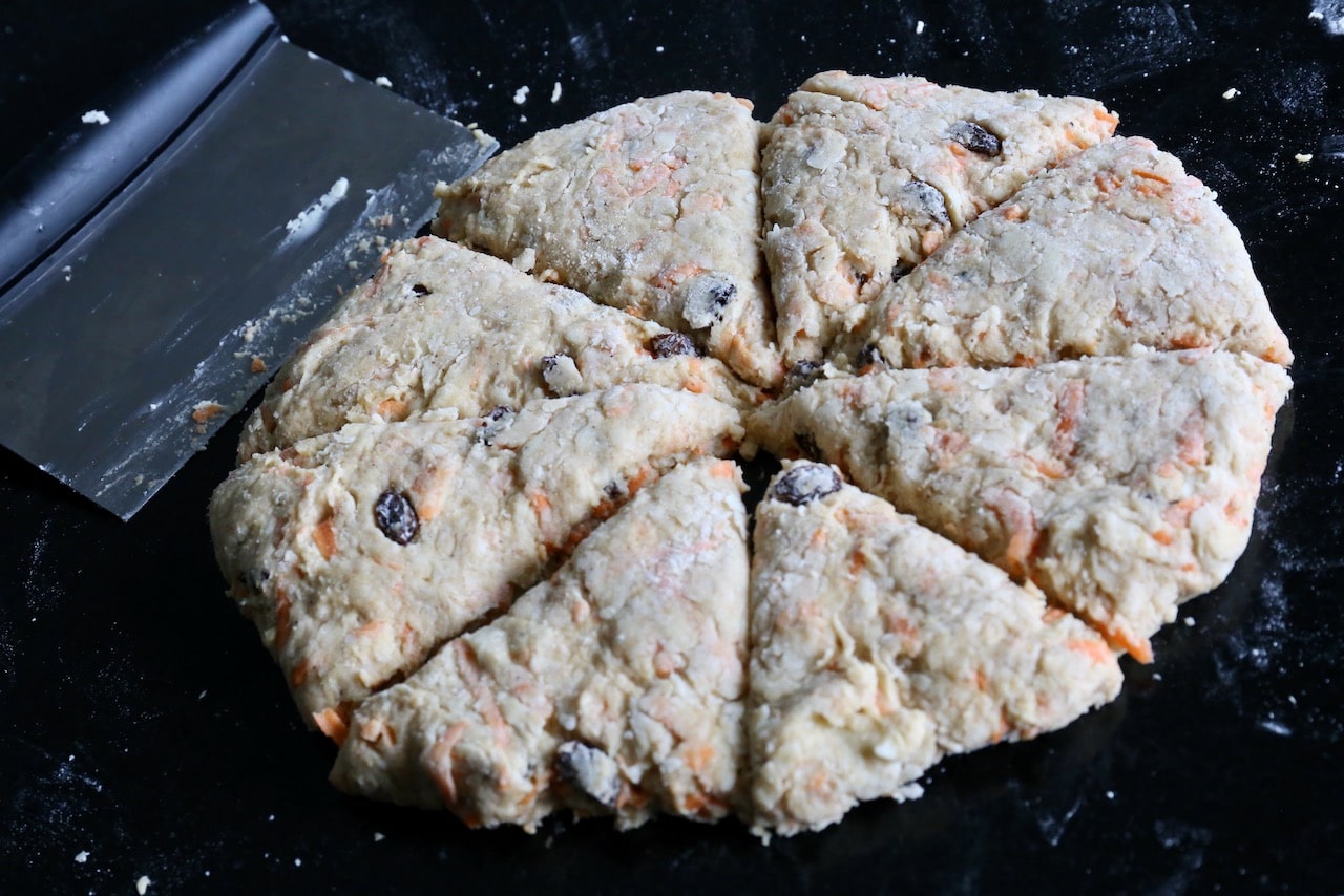 Roll the scone dough into a circle and slice into triangles.