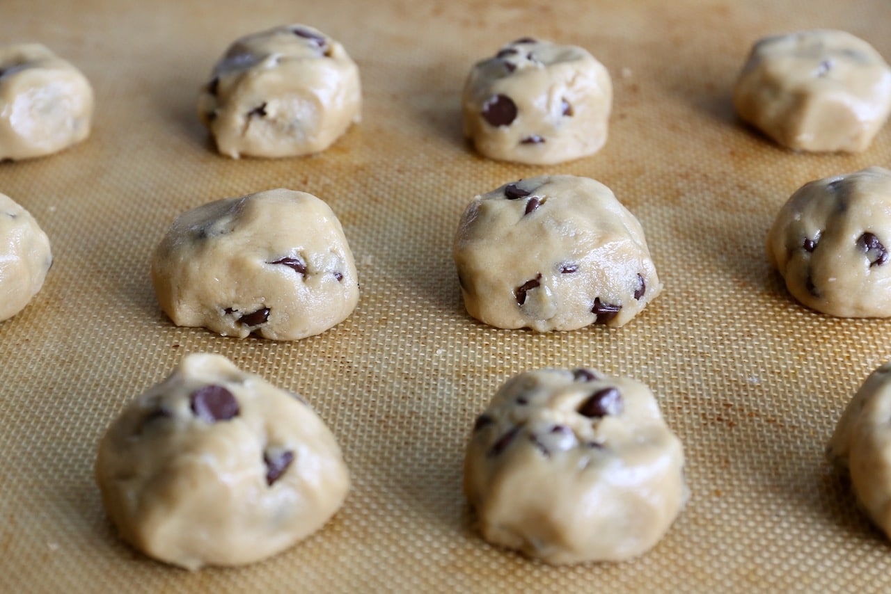 Roll cookie dough into ping pong-sized balls and place on a baking sheet.