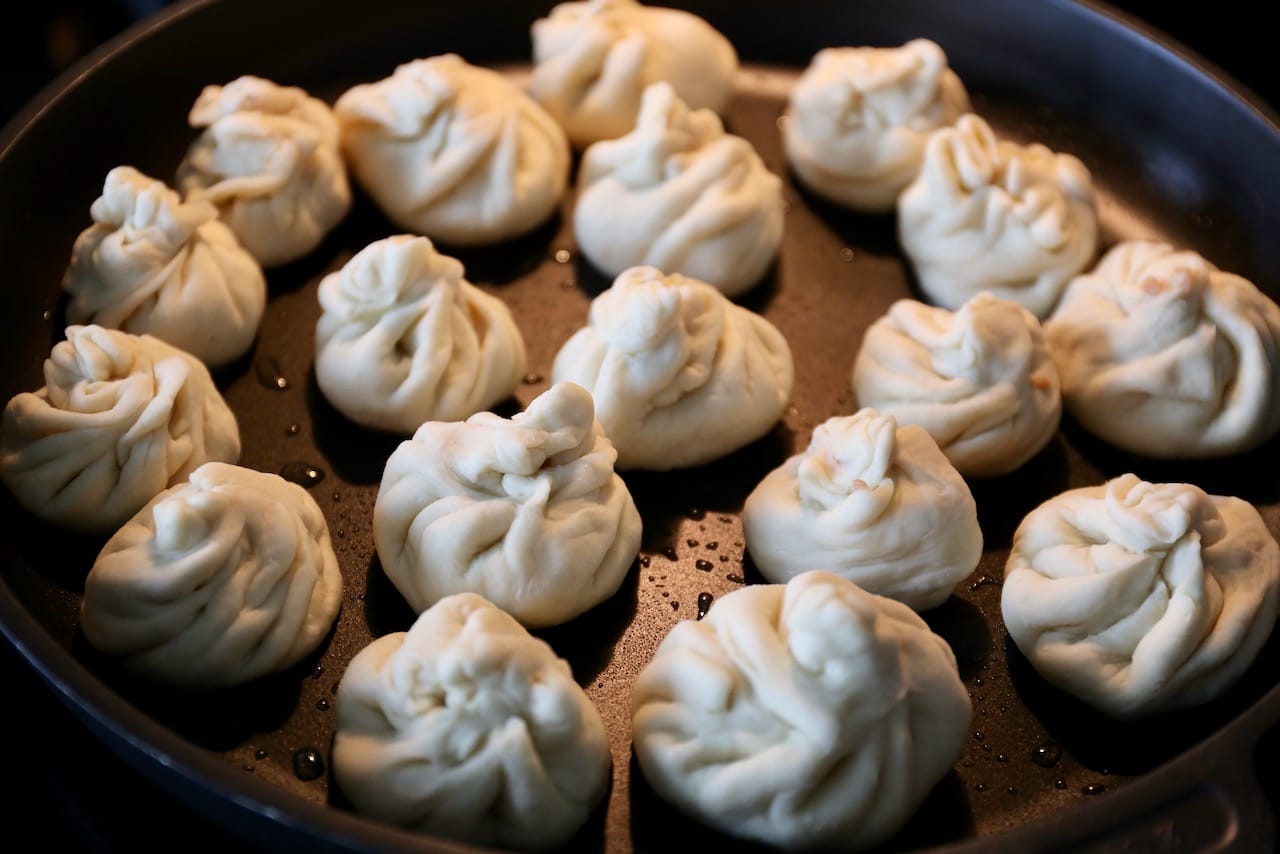 Cook Pan Fried Pork Buns in a nonstick skillet.