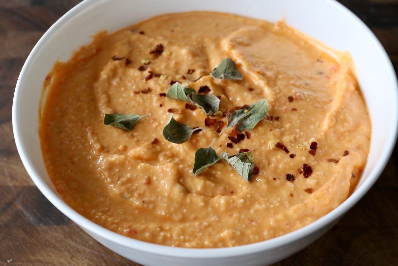 Garnish Spicy Greek Feta Dip with chili flakes and oregano.