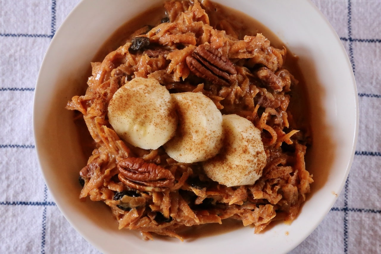 Garnish Sweet Potato Breakfast Bowls with sliced banana, cinnamon and roasted pecans.