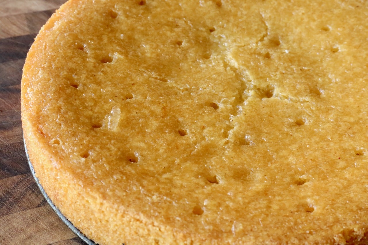 Top Vegan Polenta Cake with a sweet lemon syrup to make it moist.