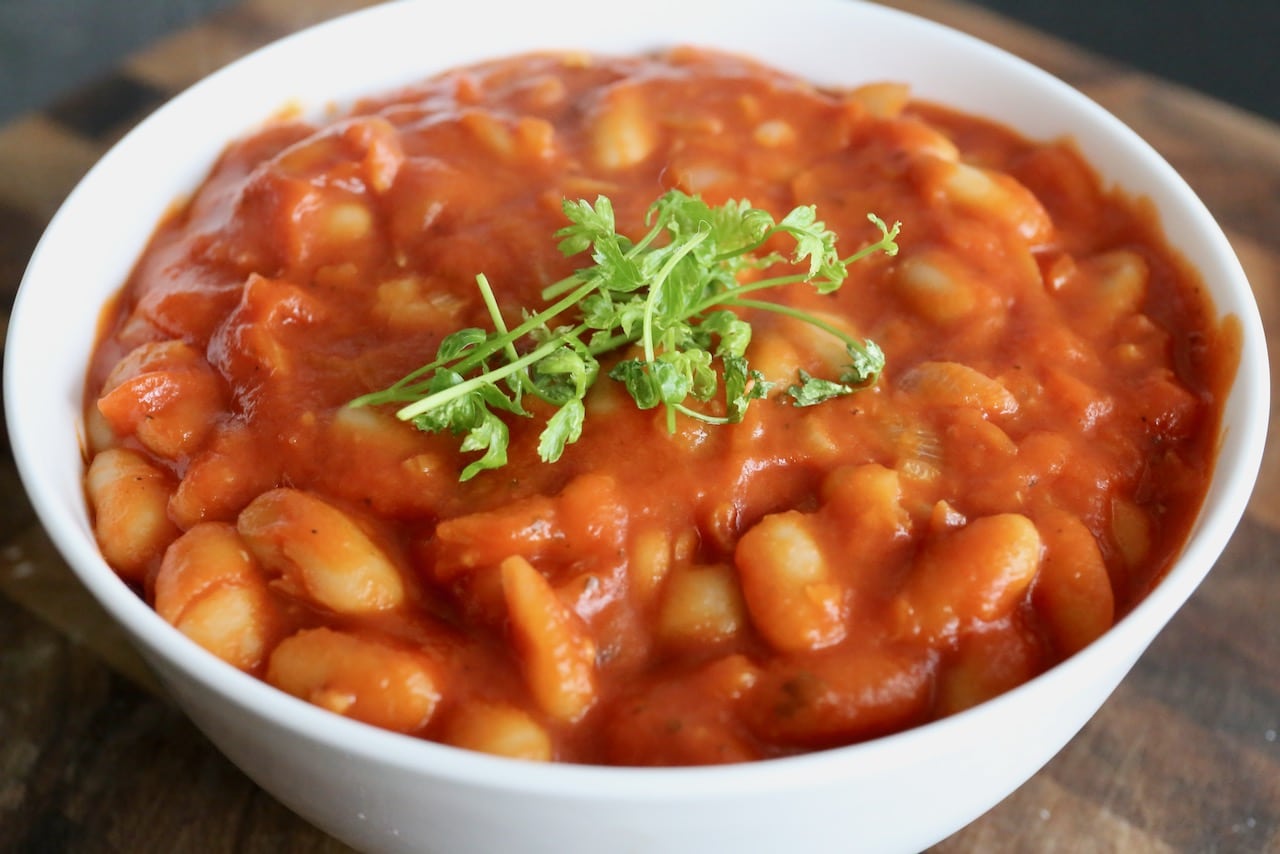 Garnish authentic Fagioli all'Uccelletto with fresh parsley.