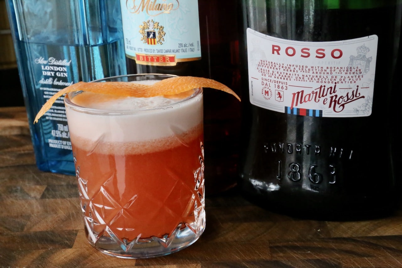 Serve a Negroni Sour in a rocks glass. 