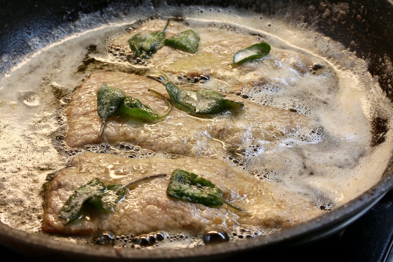 Piccatina di Vitello is flavoured with white wine, lemon and sage leaves.