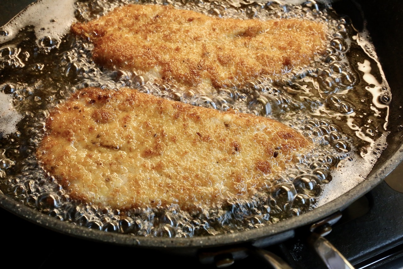 Shallow fry breaded Turkey Escalope in a skillet until crispy and browned. 