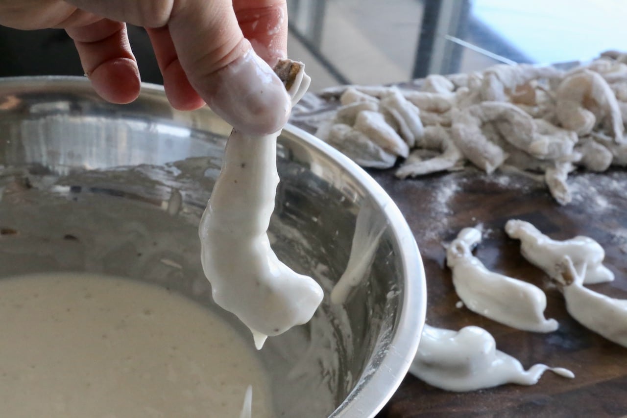 Dip shrimp in batter before deep frying.