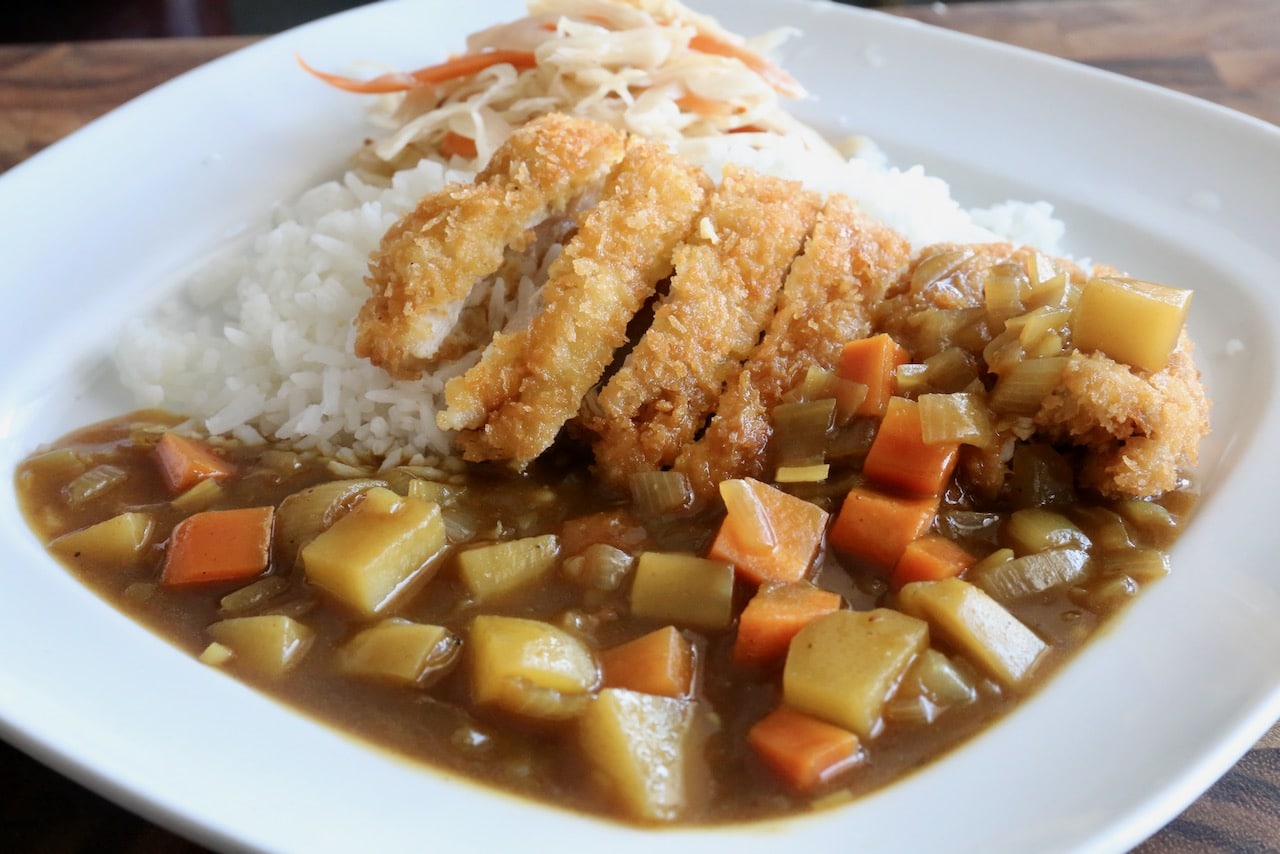 Serve Curry Katsu with steamed rice and cabbage carrot coleslaw.