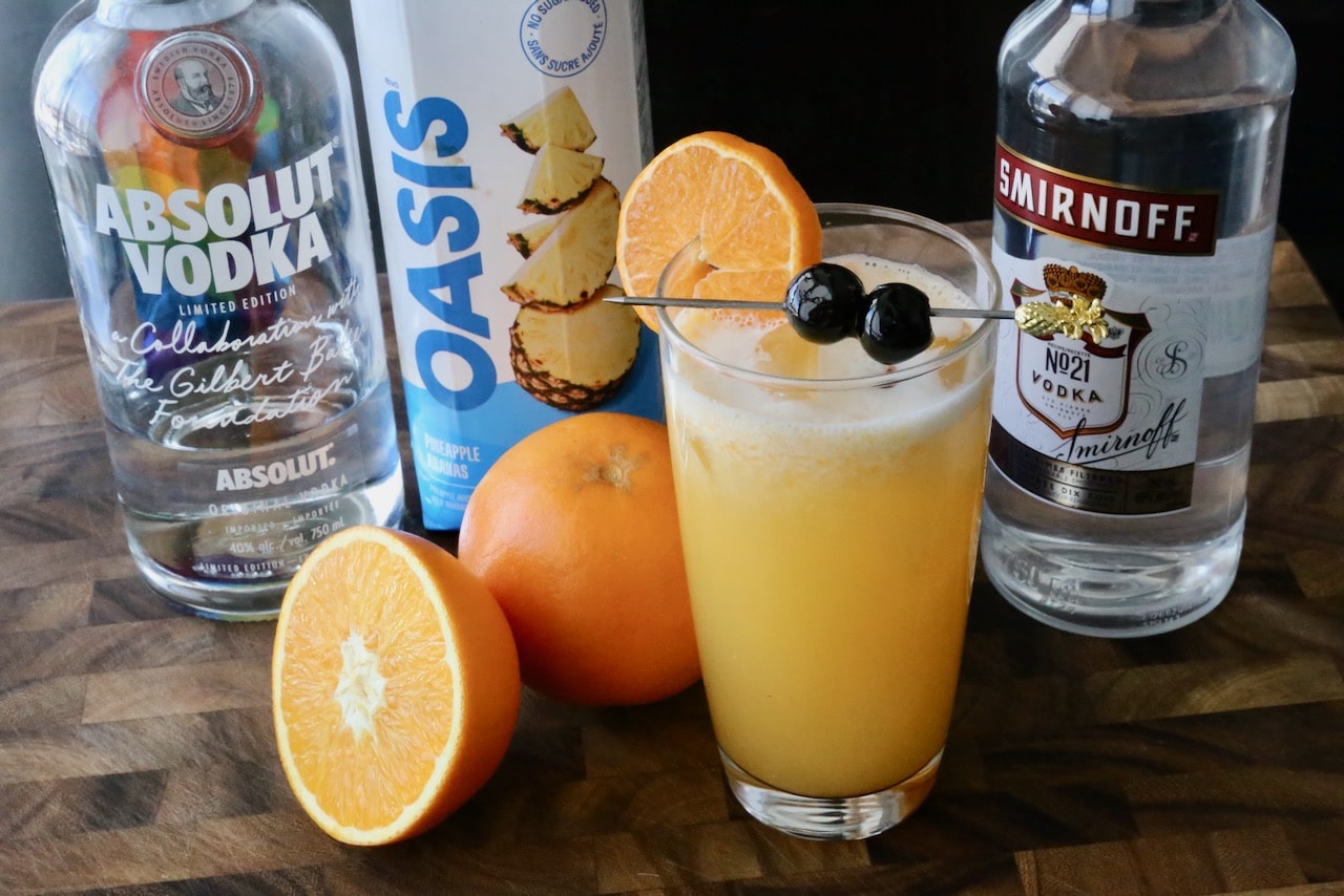 Garnish this Screwdriver cocktail recipe with maraschino cherries and an orange wheel.