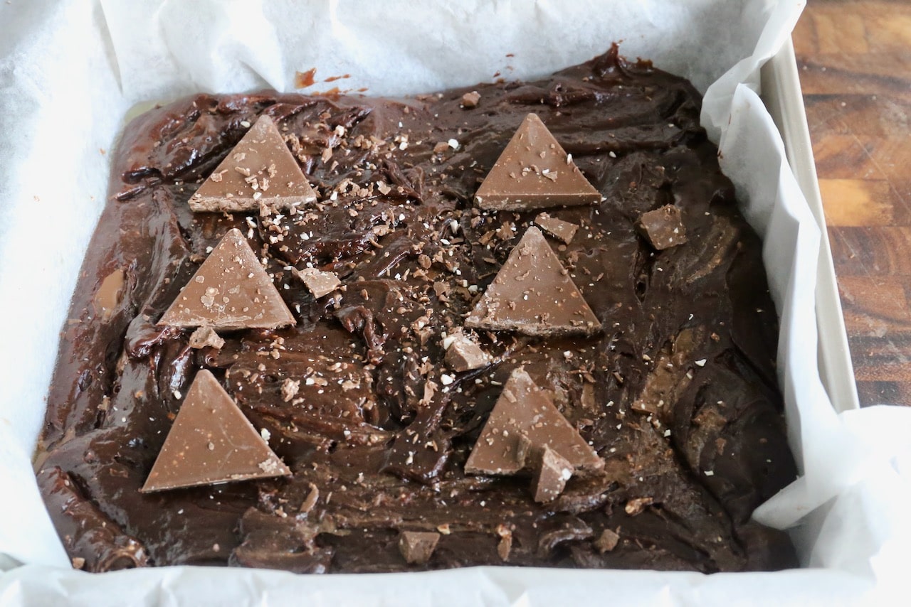 Top the brownies with Toblerone chocolate bar slices before baking.