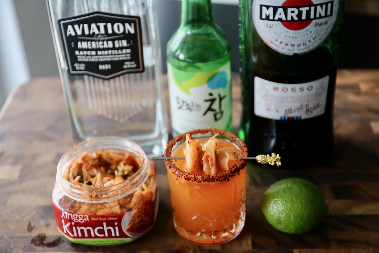 Garnish this spicy Korean Soju Cocktail with a kimchi skewer.