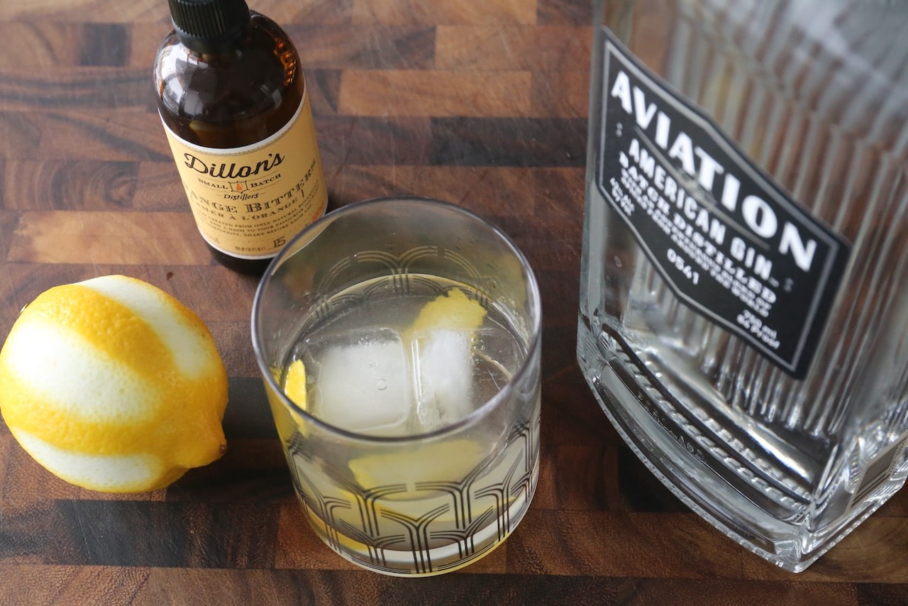 Flavour a Gin Old Fashioned Cocktail with lemon peel.