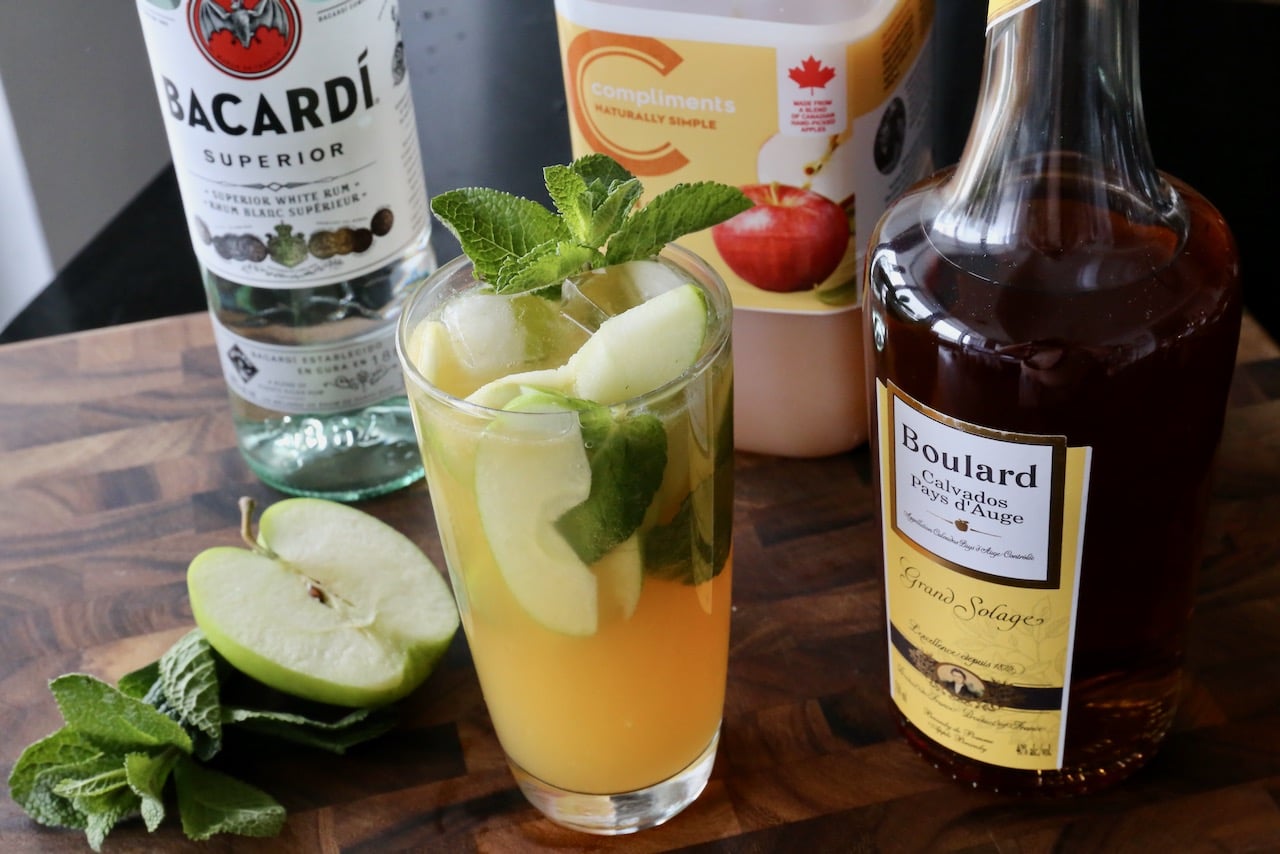 Garnish a Green Apple Mojito Cocktail with a sprig of fresh mint. 