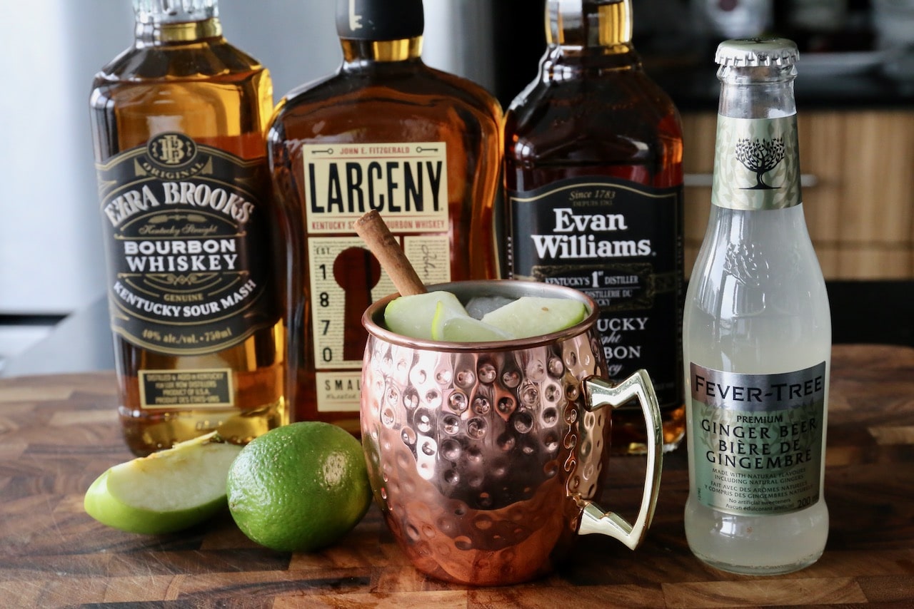 Serve the cocktail garnished with sliced Granny Smith apples and a cinnamon stick.