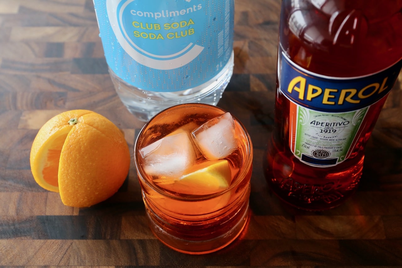 Garnish this Aperol and Soda recipe with an orange slice.
