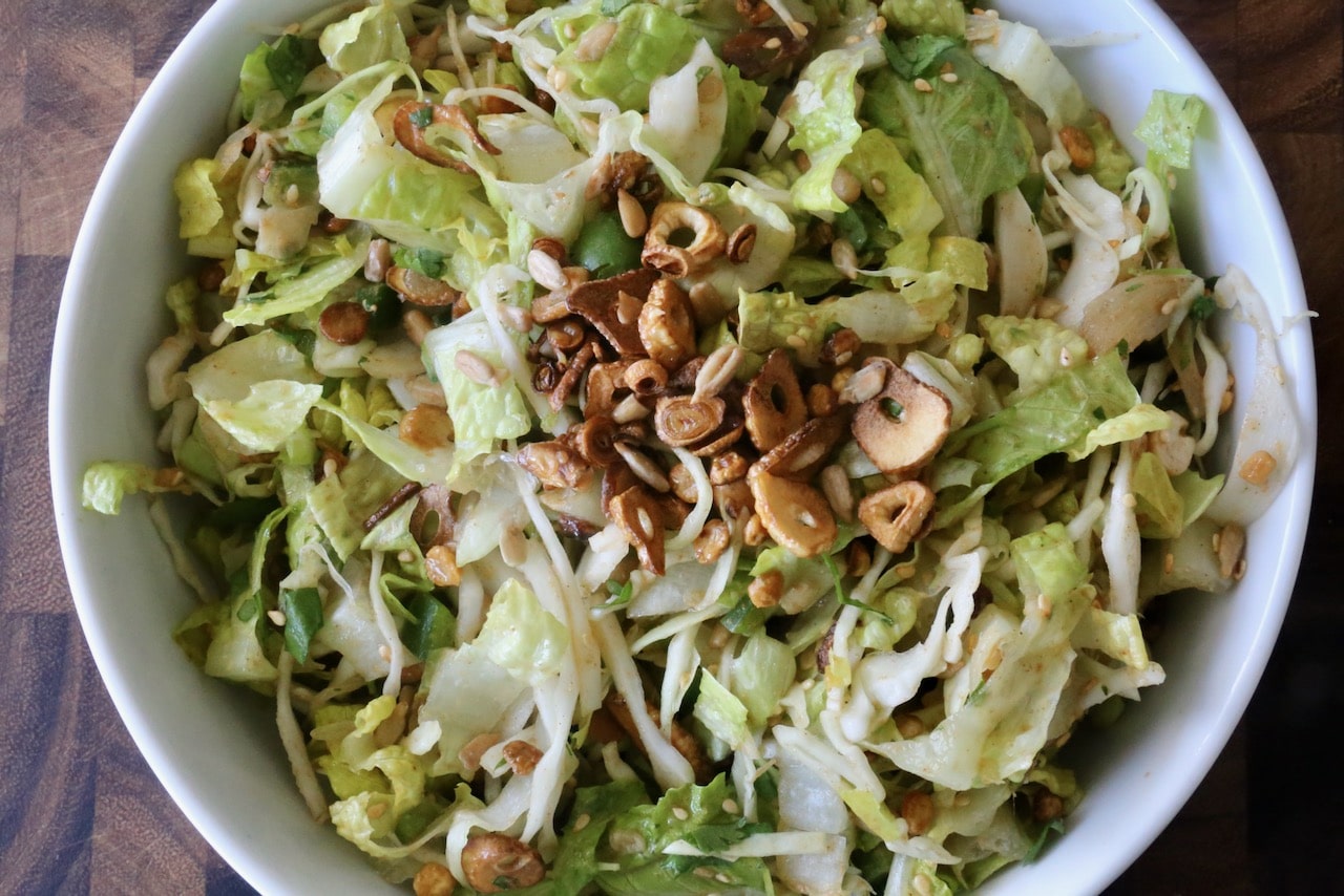 Garnish Pickled Ginger Salad with fried garlic chips.