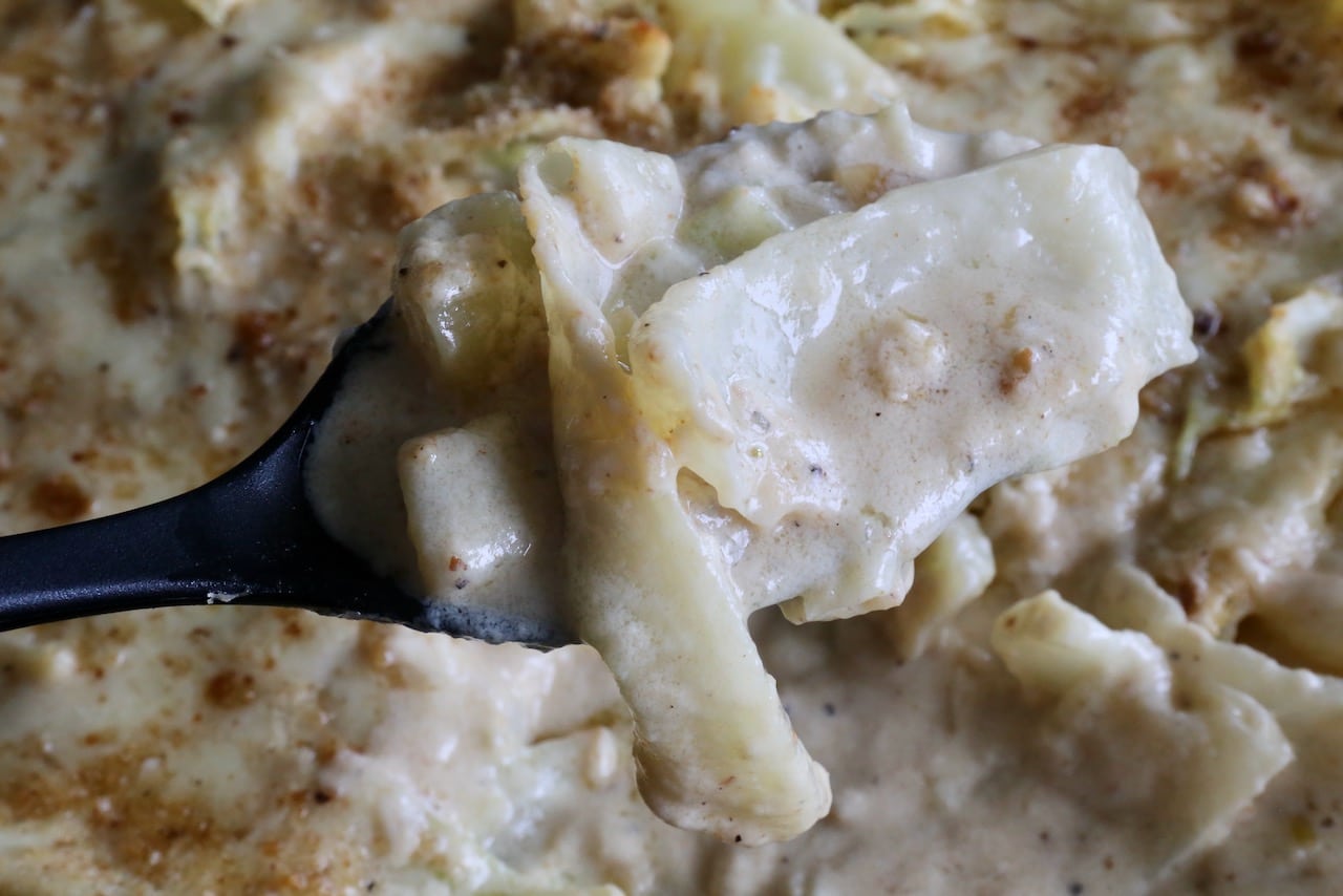 Scoop the Cabbage Cheese Bake onto plates using a large serving spoon.