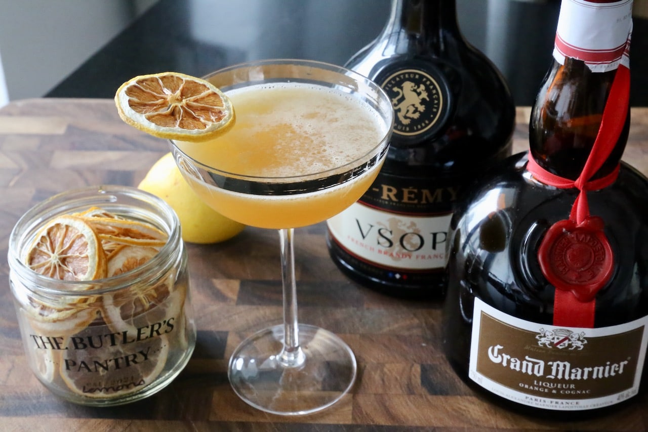 Serve a Sidecar cocktail in a coupe glass.