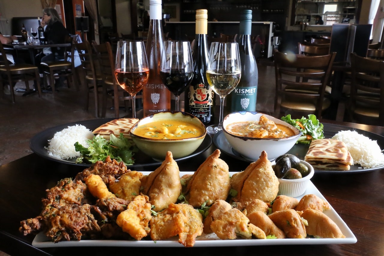 Looking for wineries in Osoyoos serving Indian cuisine? Enjoy a feast at Kismet Estate Winery. Pair Merlot with Masala! 