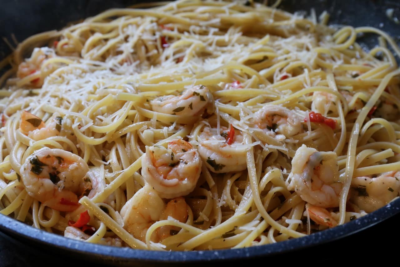 Toss prawns in linguine noodles and parmesan cheese.