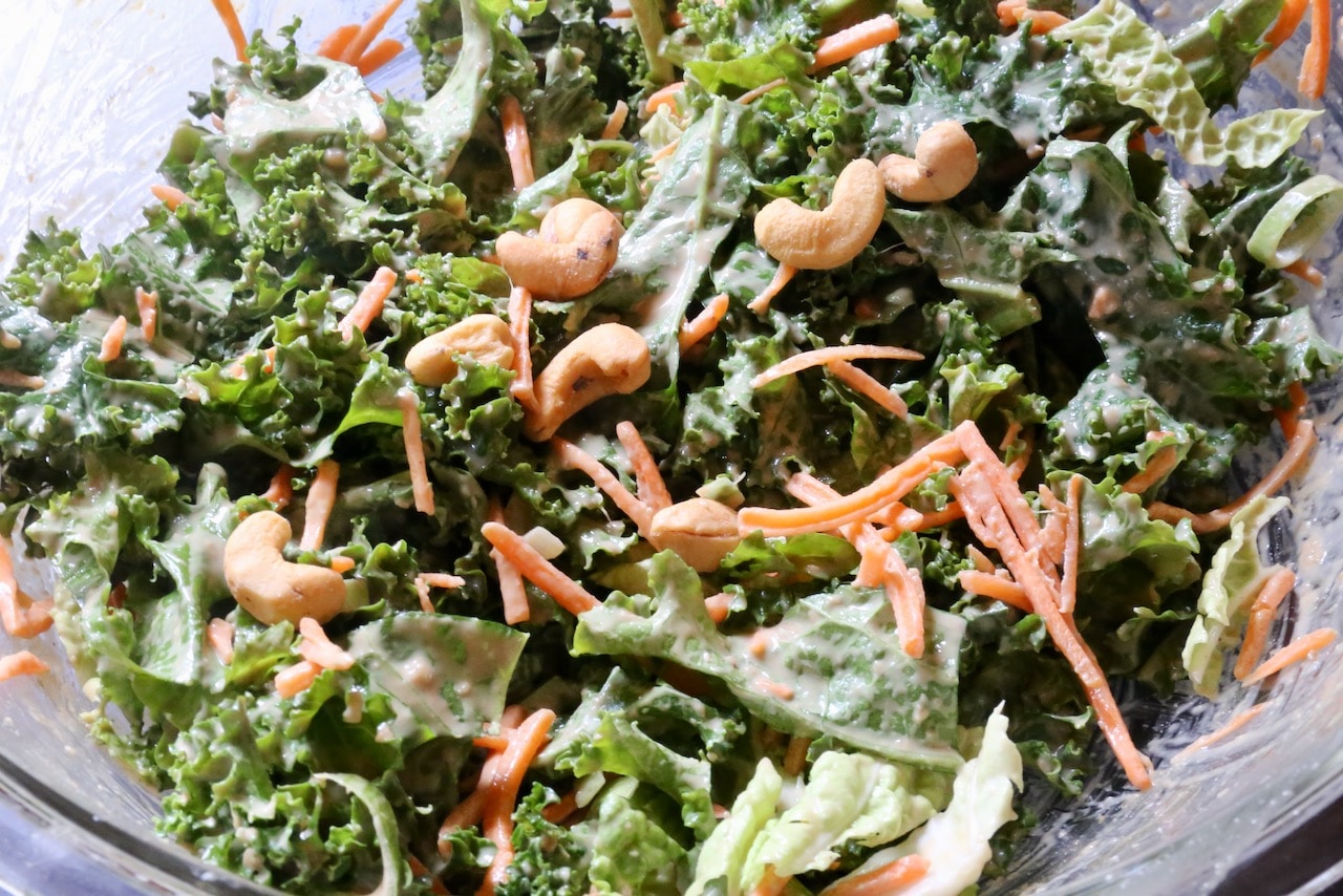 Tahini Miso Dressing is the perfect creamy sauce to toss with crunchy kale for a healthy vegan salad.