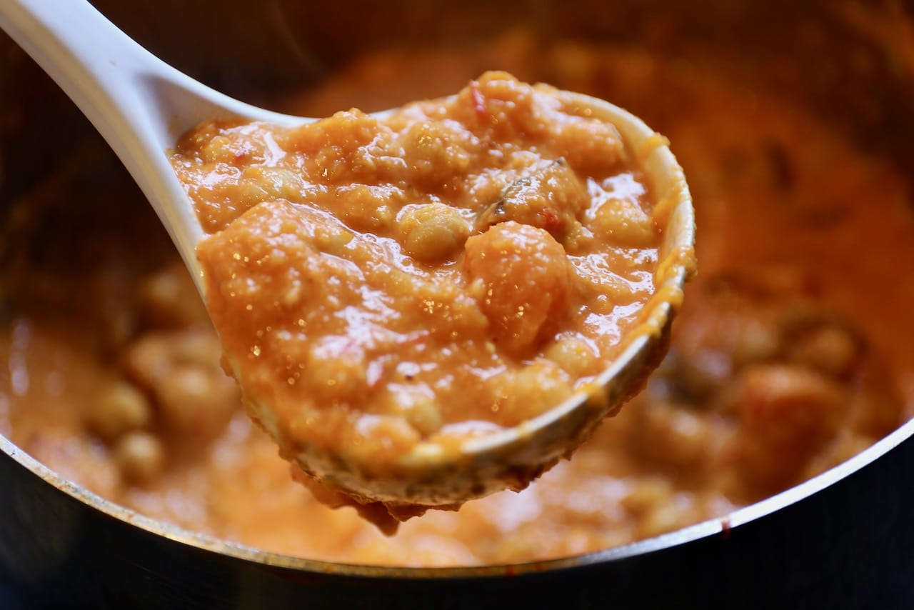 Use a ladle to scoop this thick curry into bowls. 